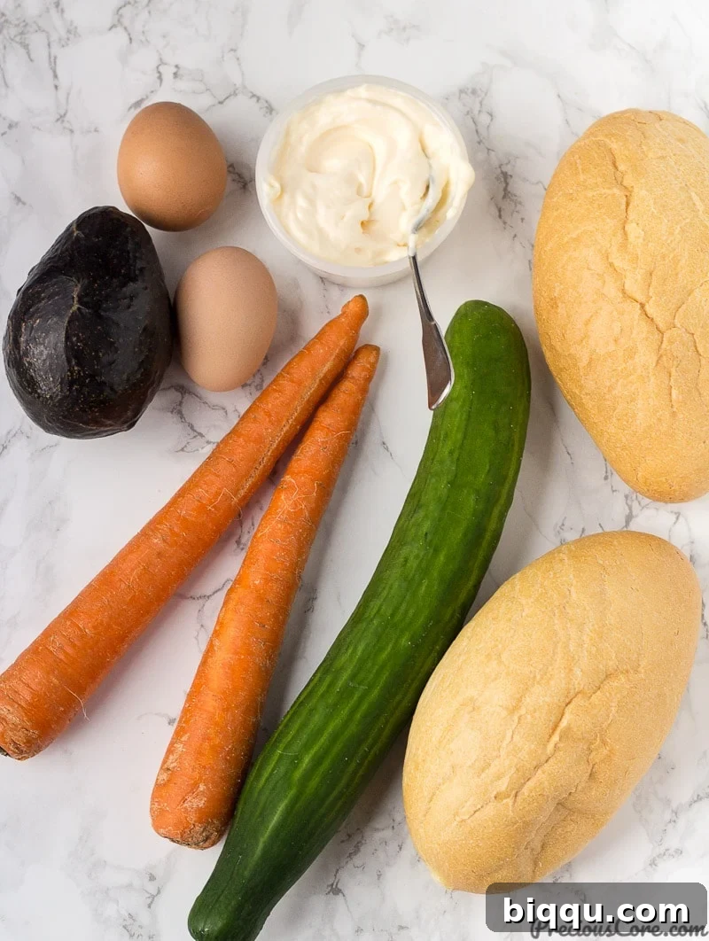 Ingredients for Breakfast Salad: carrots, cucumber, hard-boiled eggs, avocado, mayonnaise, salt, and pepper