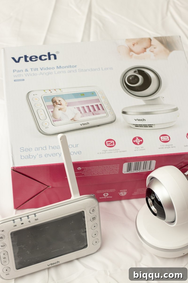 Mom preparing for a new baby, using a baby monitor