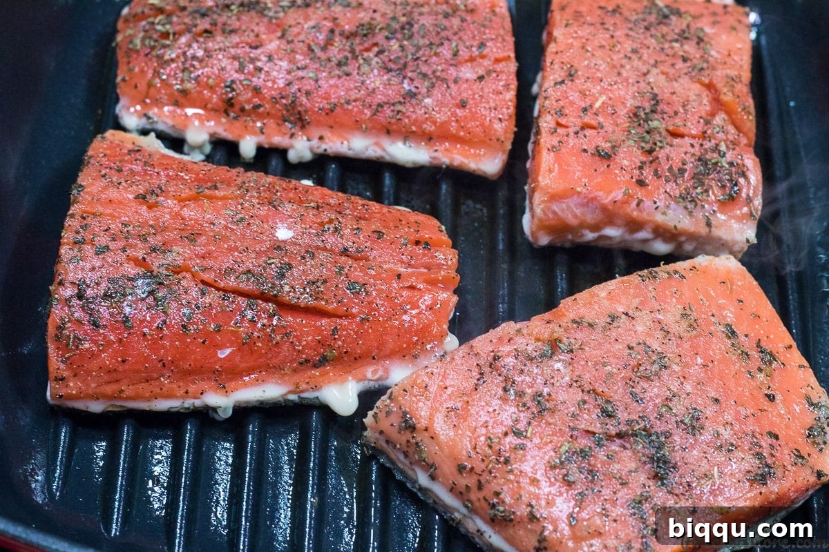 Grilling salmon in pan