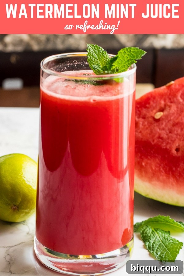 Glass of vibrant red Watermelon Mint Juice with fresh mint leaves.