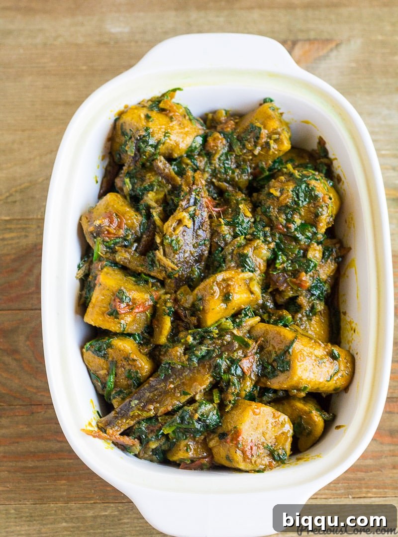 Delicious West African plantain porridge, a hearty one-pot meal with savory plantain pieces cooked in rich palm oil and spices.