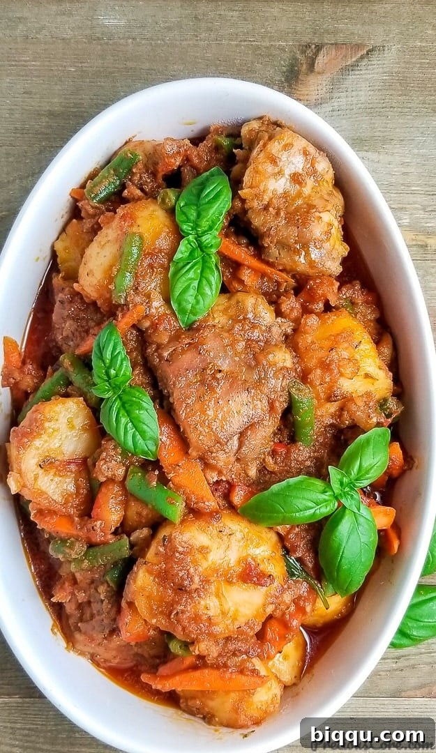 Rustic potato hotpot, a hearty and comforting meal garnished with fresh basil, served in a warm bowl.
