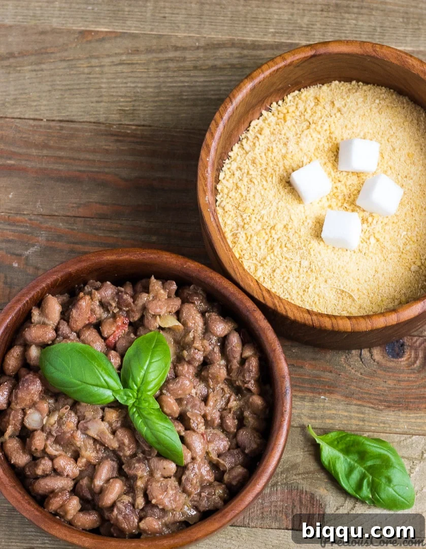 Traditional African Garri (cassava granules) served with savory stewed beans, a beloved, comforting, and casual meal.