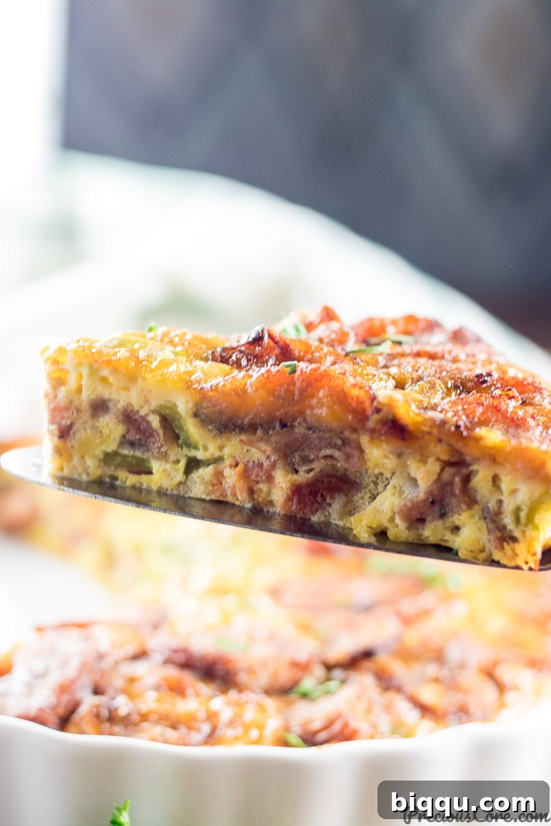 Island Frittata 3 A perfectly baked slice of Plantain Frittata, showcasing golden plantains and a rich egg base