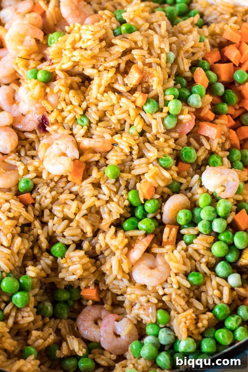 One-pot Jollof Rice with Shrimp recipe featuring fresh vegetables