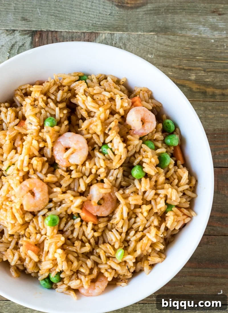 A vibrant plate of African Jollof Rice with Shrimp, ready for dinner