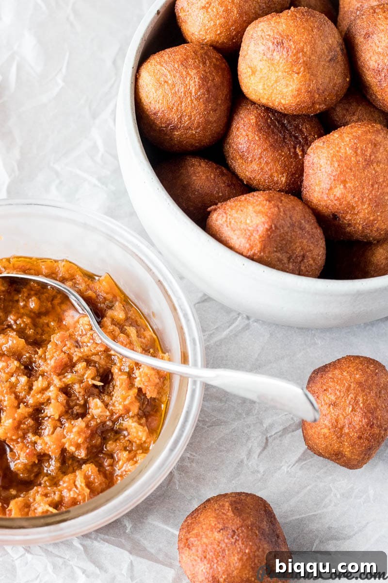 Accra Banana - African Banana Fritters served with a vibrant pepper sauce.