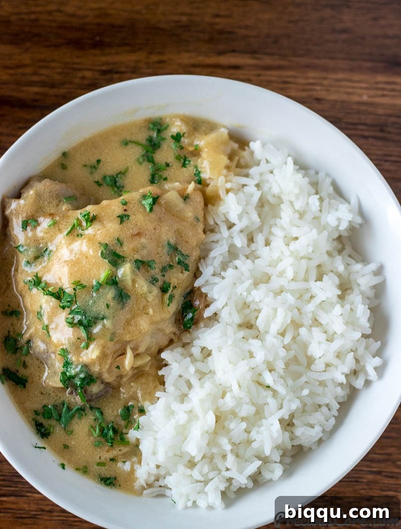 Close-up of golden-brown chicken in creamy white sauce