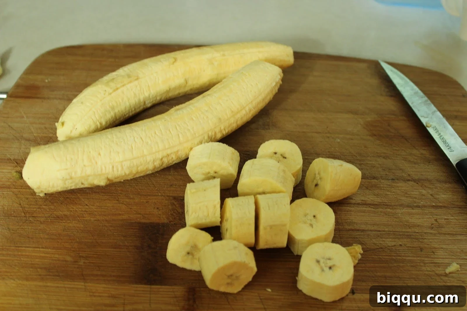 Hearty Plantain Porridge 3 Sliced unripe plantains placed in a cooking pot, ready for the next ingredients.