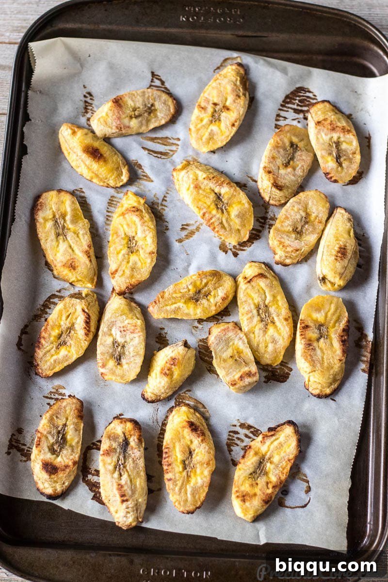 Baked Plantains perfectly arranged on a baking sheet, ready to be served