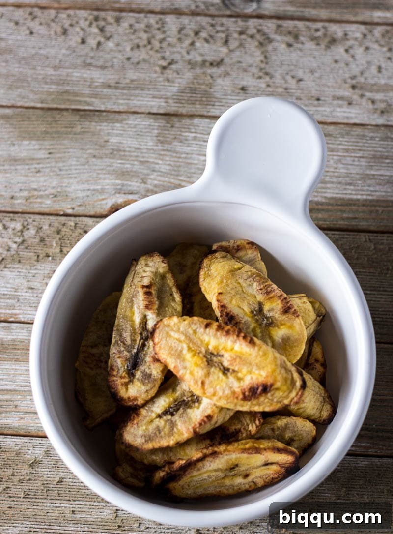 A bowl filled with beautifully baked plantains, ready to be enjoyed as a healthy snack or a side dish