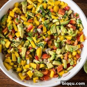 Mango Avocado Salsa in a white bowl, a fresh and vibrant dish perfect for any occasion.