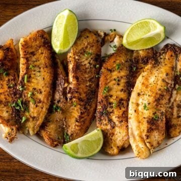 Pan Seared Tilapia on a serving tray with lime wedges, as shown in the recipe card.