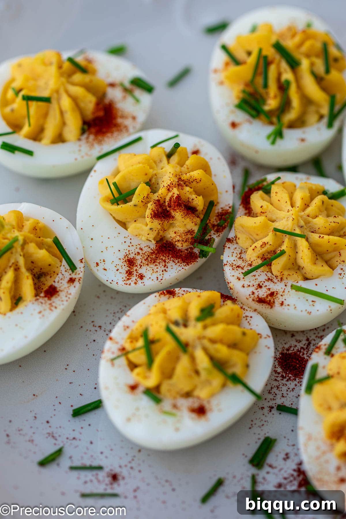 Deviled eggs with toppings.