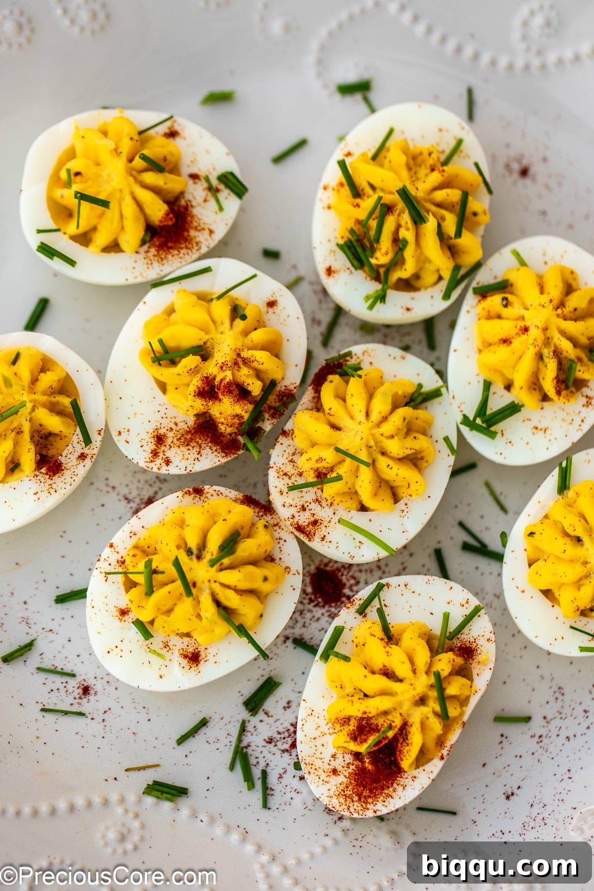 Deviled eggs with paprika and herbs.