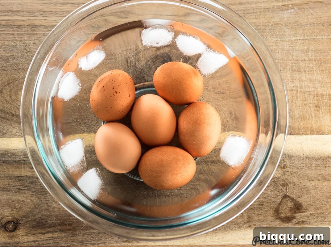 Hard boiled eggs in water and ice