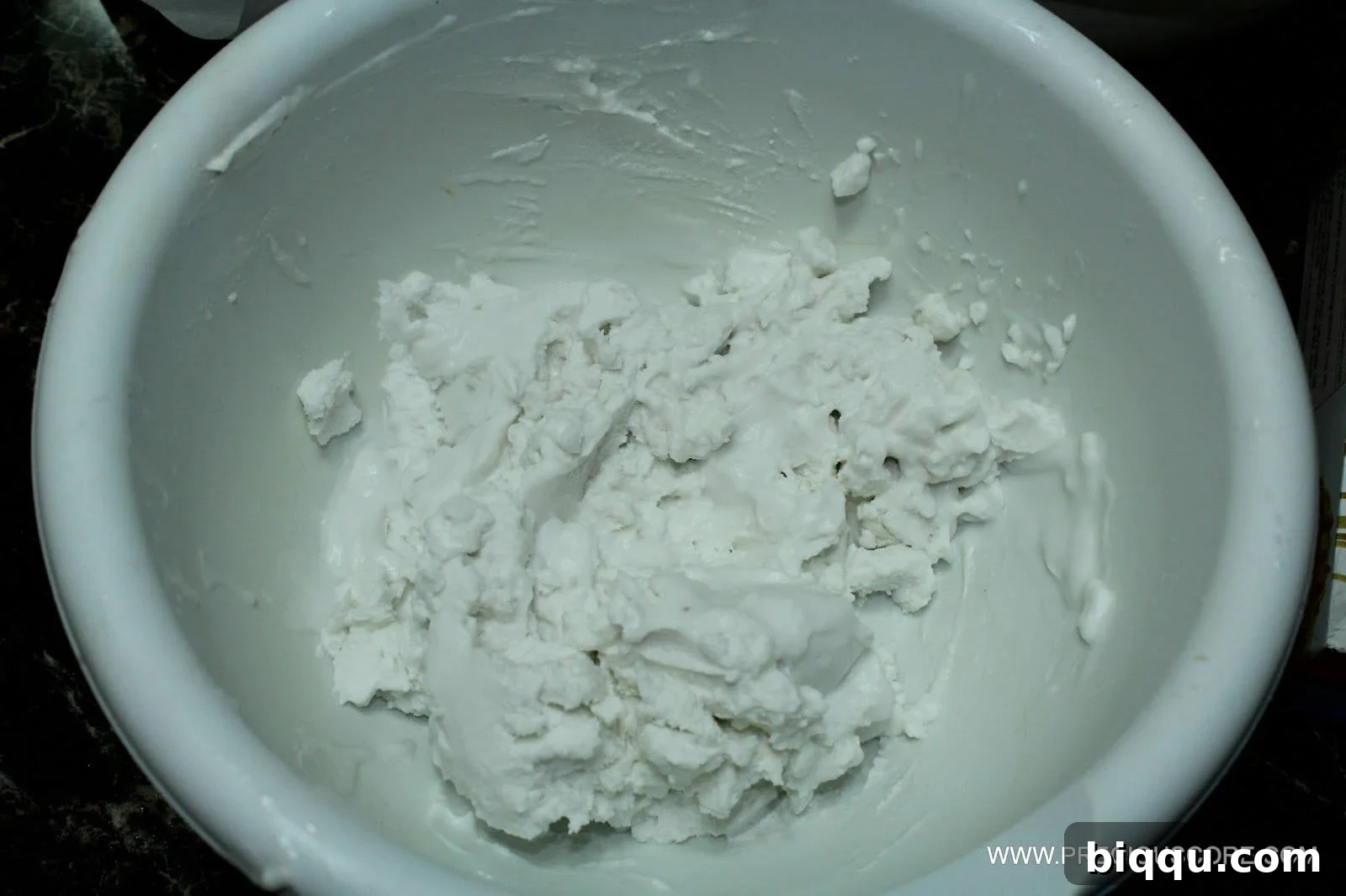 Coconut cream in a bowl, ready to be whipped for the fruit pizza sauce.