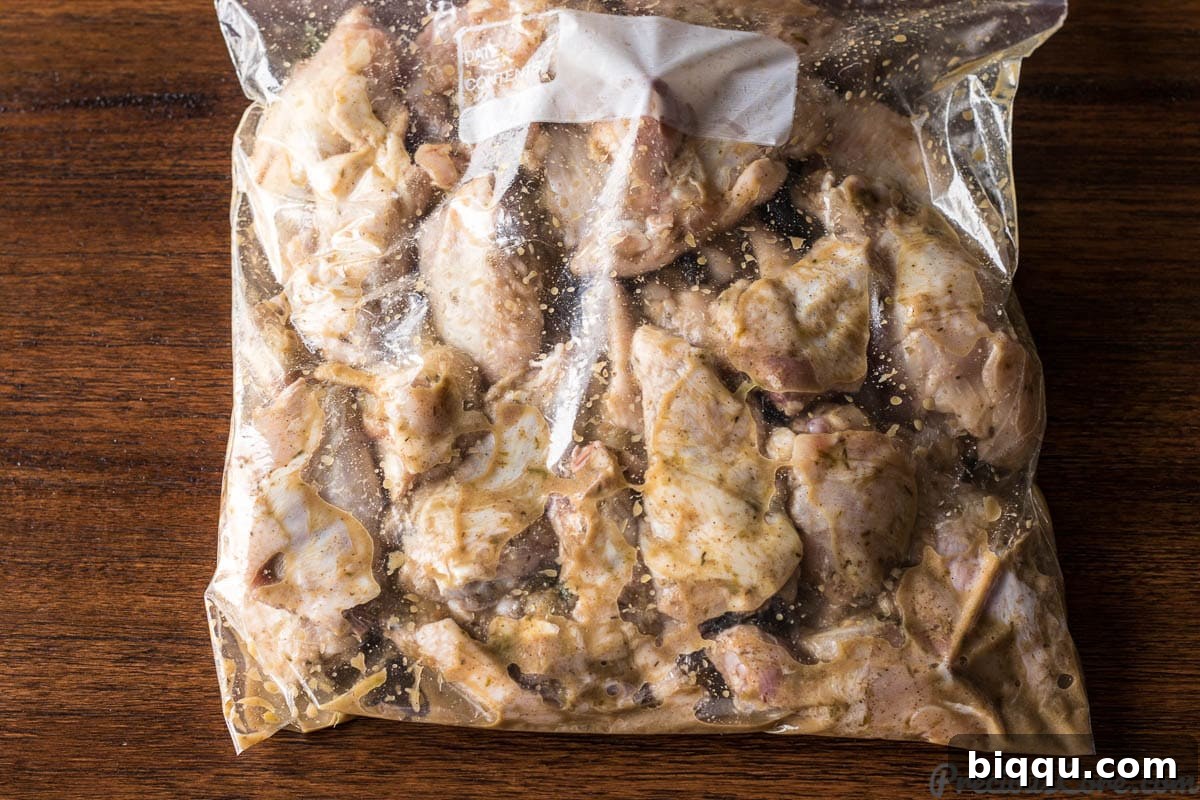 Jerk chicken wings marinating in a Ziploc Bag