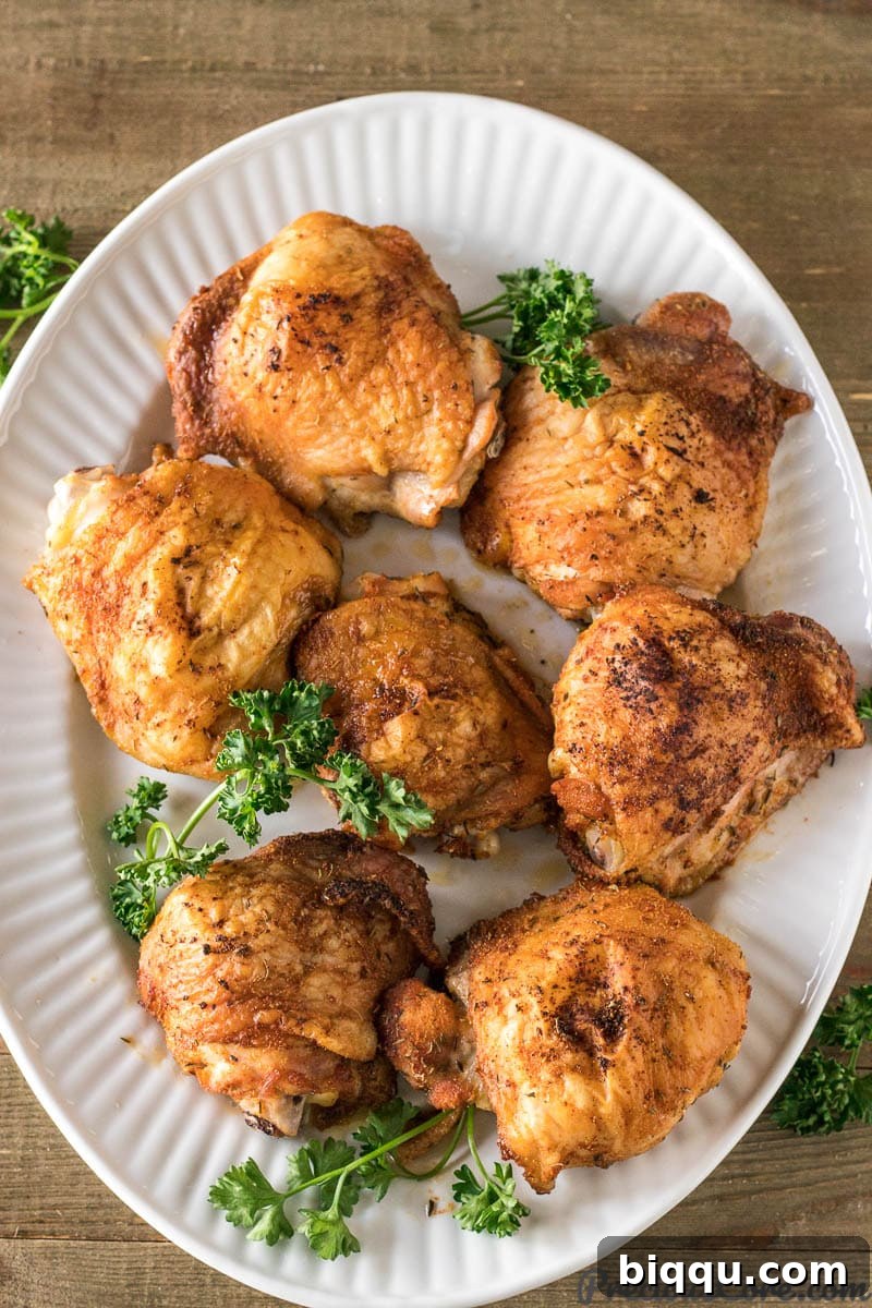 Crispy baked chicken thighs on a serving tray
