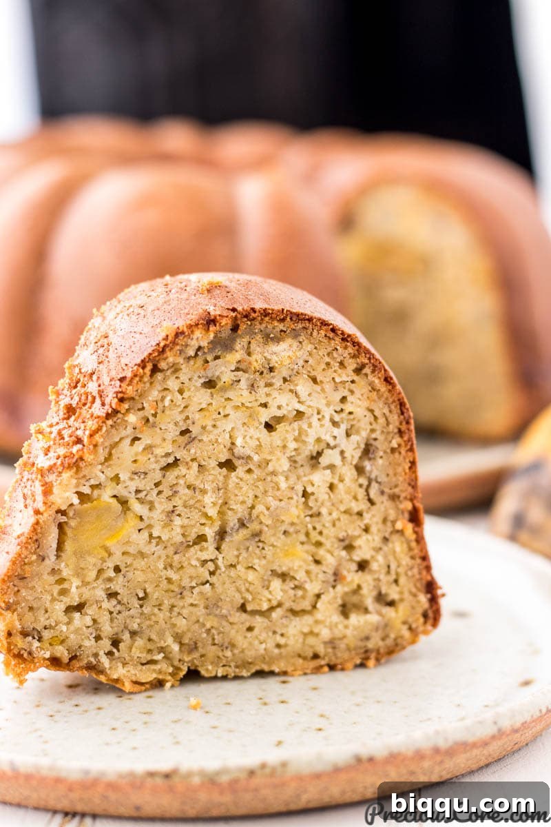 A beautiful slice of golden plantain cake, perfectly moist and ready to be enjoyed.