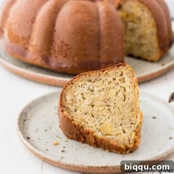 Slice of plantain cake on speckled plate