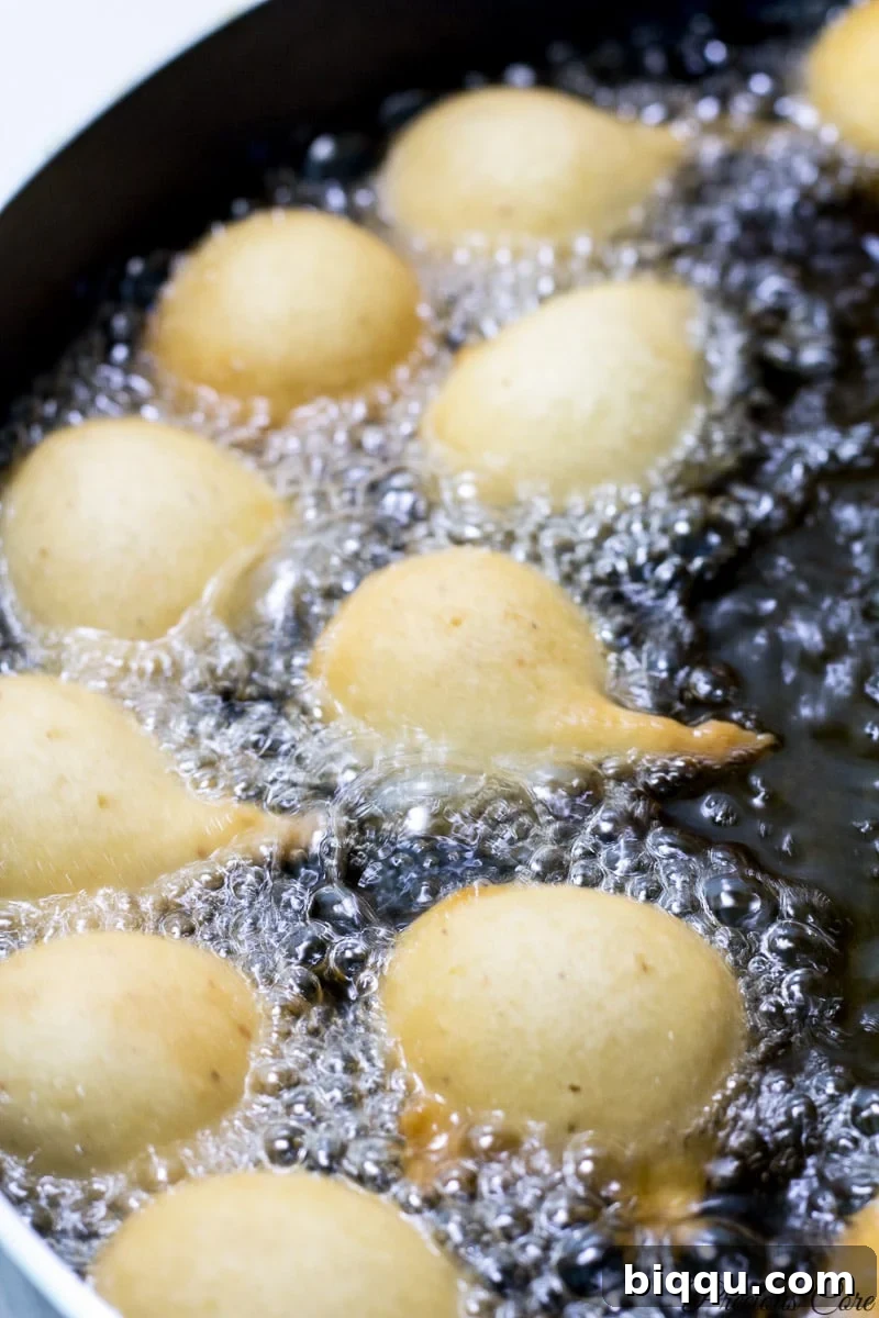 Frying cameroon doughnuts in hot oil until golden.