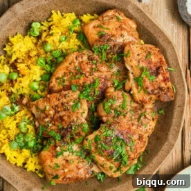 Pan Seared Boneless Chicken Thighs with yellow rice.