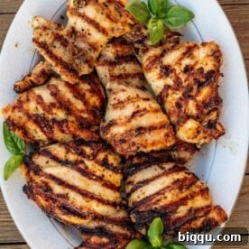 grilled boneless chicken thighs on a platter