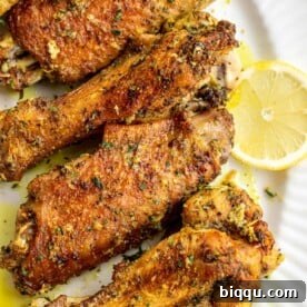 Lemon pepper turkey wings on a serving platter.