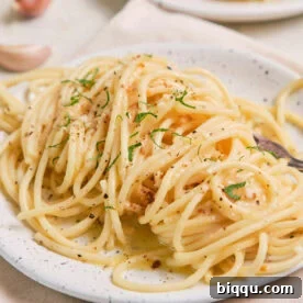 Lemon Garlic Butter Pasta on a speckled plate.
