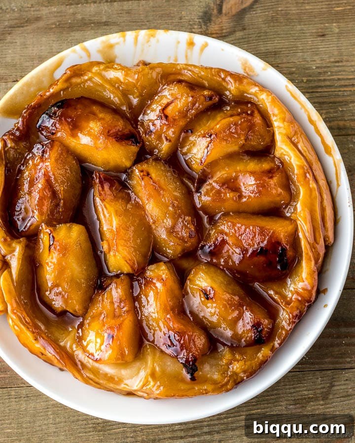 The inverted Tarte Tatin, showcasing the perfectly caramelized apples, on a serving plate