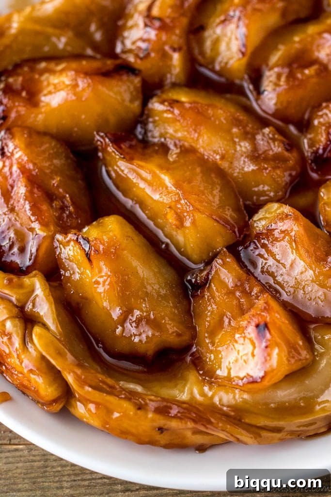 Close-up shot of the perfectly caramelized apples within the Tarte Tatin