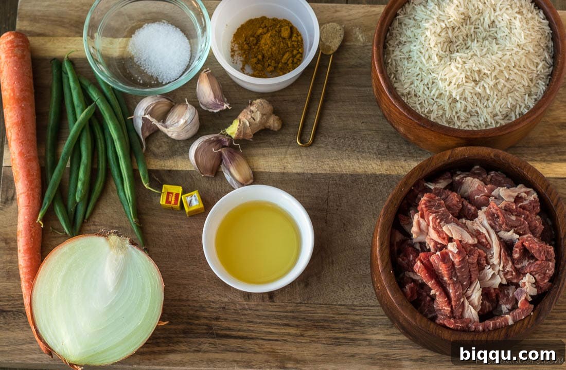 Arrangement of key ingredients for Beef Fried Rice: raw beef slices, basmati rice, ginger, garlic, spices, and cooking oil on a rustic chopping board.
